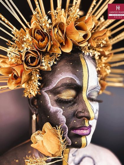 Another angle of the black, white, and gold fantasy makeup, with eyes closed to show the detailed eyeshadow work.