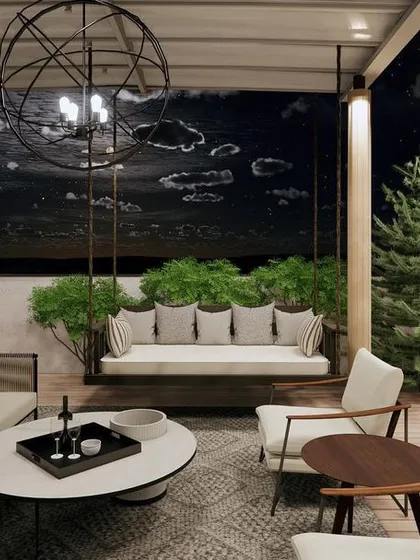 I designed this rooftop terrace as the ultimate evening retreat. With a comfortable sofa, a swinging daybed, and lush planters under a starry sky, it’s the perfect space for relaxing and entertaining.