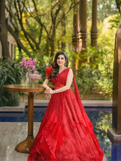 A full-length shot of the bride by the pool. Her makeup is designed to be flawless and long-lasting, perfect for an outdoor event.