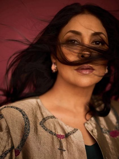 An artistic close-up with hair blowing in the wind, creating a dramatic and memorable shot.