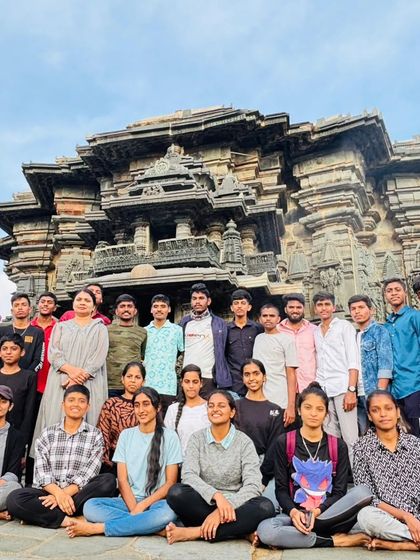 The NCC student group posing in front of the historic Belur or Halebidu temple, which we often visit as part of our customized trek packages.