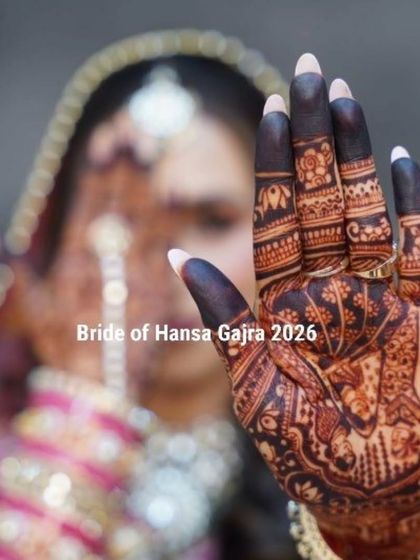 A close-up of this bride's hand, showcasing the intricate finger work and the beautiful portrait that forms the centerpiece of her design. The dark stain brings out every detail.