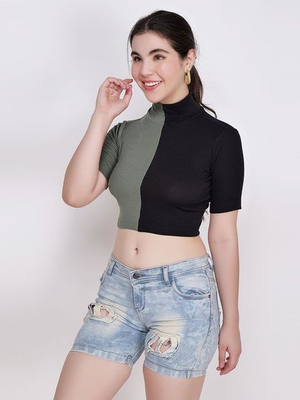 A smiling model in a green and black crop top, creating an engaging and positive image for customers.