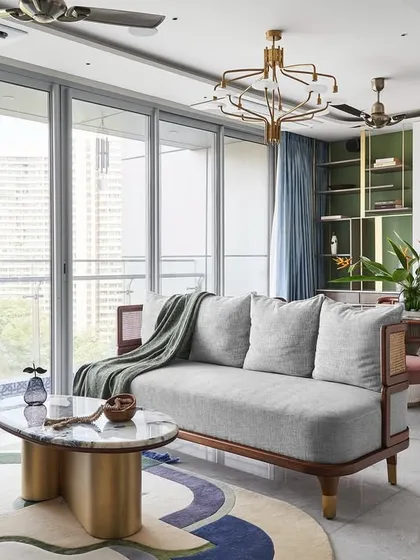 An expansive view of the Whimsical House, showcasing an open-plan living, dining, and kitchen area. I designed this space to feel bright, airy, and connected, using a playful color palette and custom furniture like the 'Ananta' center table to create a home that is both stylish and perfect for family life.