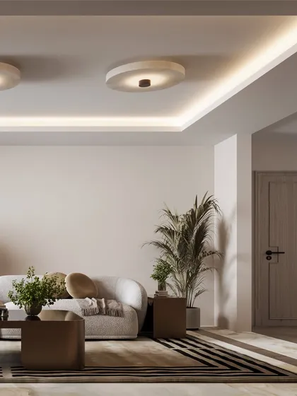 This perspective shows the open, airy feel of the room, with its neutral color scheme and strategically placed plants.