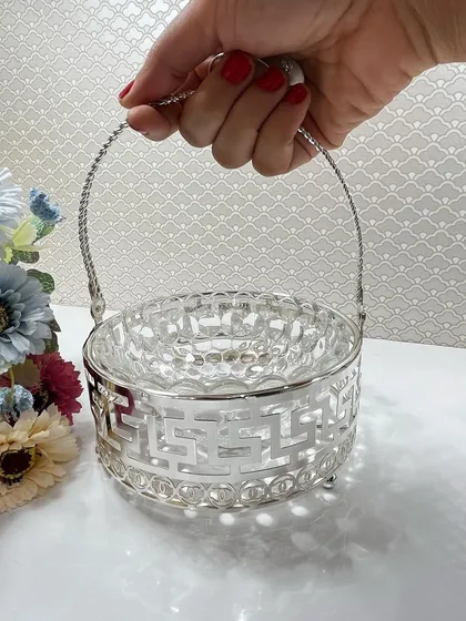 This silver-plated basket features a classic Greek key pattern, offering a timeless design for your home. It is perfect for holding dry fruits, candies, or even as a decorative piece on its own.