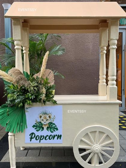 Even the food carts are themed, like this charming popcorn cart decorated with jungle foliage.