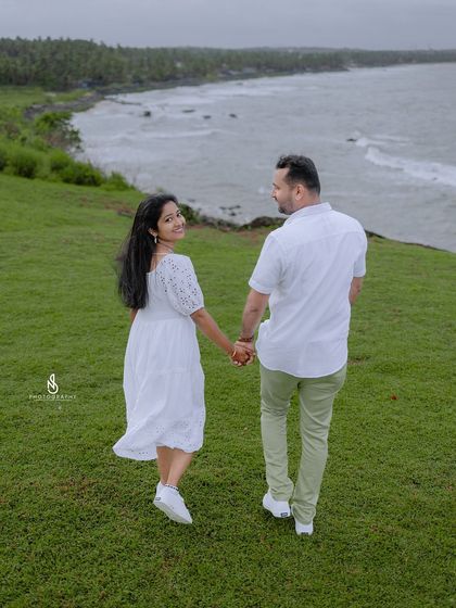 Walking away from the camera but looking back with a smile. This classic shot is a beautiful way to conclude a photo series.