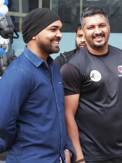 Sharing a smile with a fellow fitness enthusiast at the Decathlon Malad launch. These community events are a great way for us to connect with people who share our passion for sports.
