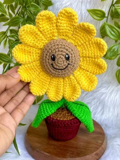 Holding the smiling sunflower pot. The cheerful expression on this flower is one of my favorite details to add.