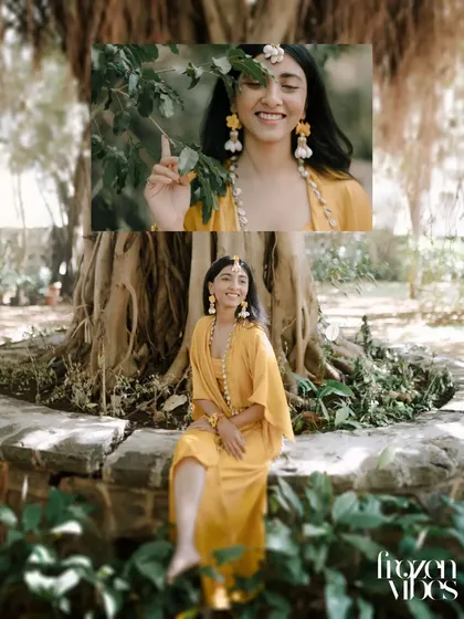 A lovely portrait of the bride, Shikha, enjoying a quiet moment in a garden. The warm, yellow tones of her outfit look beautiful against the natural greenery.