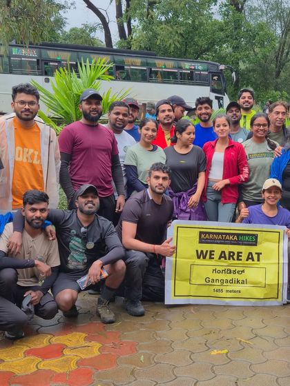Our group proudly holding the banner at the start of the Gangadikal trek.
