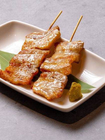Butayaki Shio, or salt-grilled pork skewers. We season high-quality pork simply with salt and grill it to perfection, letting the natural flavor of the meat shine through.
