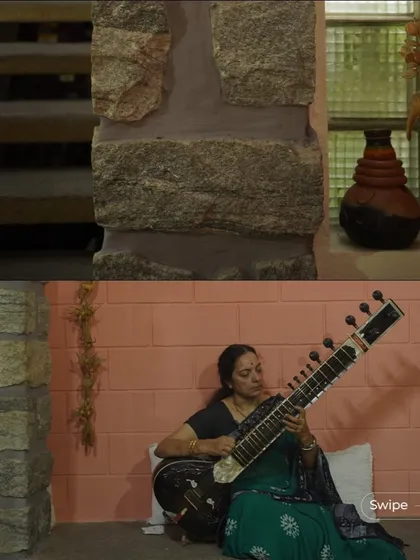 A resident playing the sitar in a specially designed nook, demonstrating how we create spaces that cater to our clients' passions and hobbies.
