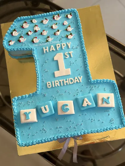 A number "1" shaped monogram cake for a very special first birthday. This is a great way to celebrate a milestone year.