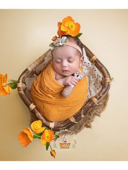 A full view of the basket setup with orange flowers. The composition is balanced and beautiful, creating a timeless piece of art.