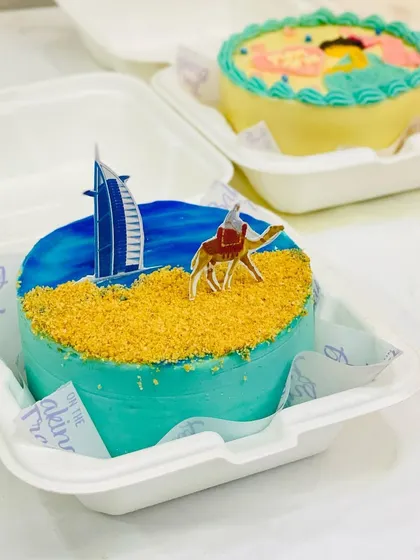 A Dubai-themed bento cake for someone dreaming of or celebrating a trip. The biscuit crumble sand is one of my favorite details.