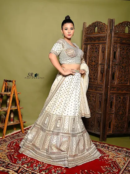 A powerful stance that shows off the full silhouette of the lehenga. This kind of confident pose is great for fashion campaigns that want to project a strong, modern image.