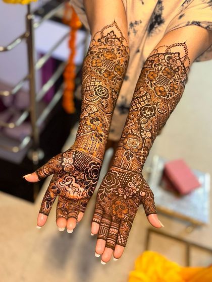 A beautiful shot of my bride's full mehendi. The design includes her groom's name, "Deepak," for a special, personal touch.