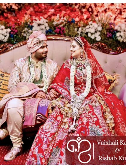 A beautiful couple seated amidst grand floral decorations. My goal is to foster enduring relationships built on love and trust, creating the foundation for a happy life together.