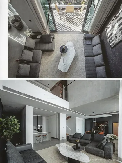 An aerial view of the living room, showing the open-to-sky balcony and the seamless connection between the indoor and outdoor spaces.