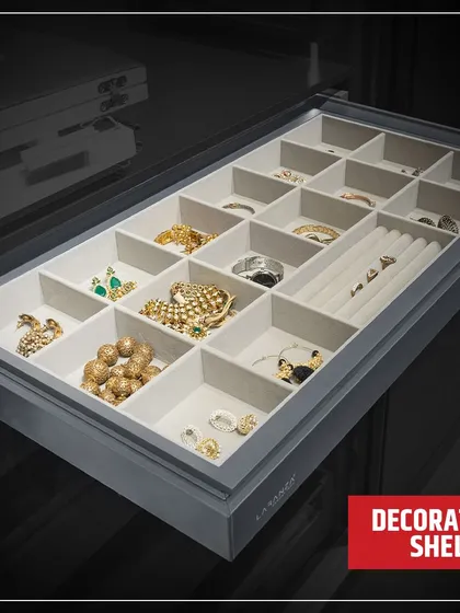 This decorative shelf is a dedicated space for your most treasured jewellery. The soft, sectioned tray prevents tangles and scratches, keeping your collection safe and beautifully displayed.