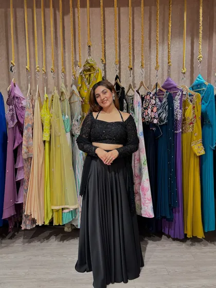 Black is a timeless classic that never goes out of style. This black lehenga set with a delicate lace blouse is a perfect addition to any trousseau, offering a chic and bold statement for any evening event or reception party.