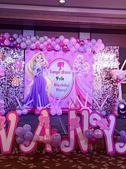 Let your child be the star of their own fairytale with our dazzling Barbie and princess theme setups. This stage features a sequin backdrop, a neon "Happy Birthday" sign, and custom 3D letters spelling out the birthday girl's name for a truly personalized touch.
