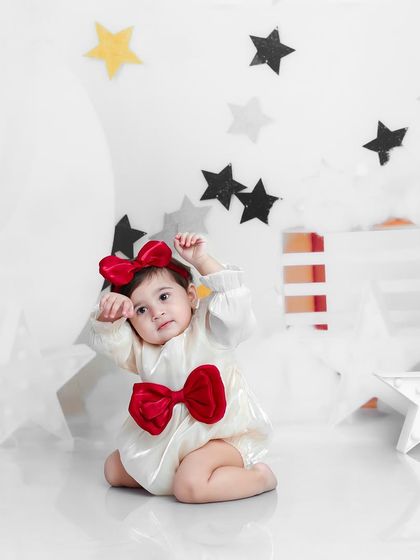 Reaching for the stars. This photo captures a playful moment from our dreamy and celestial "Moon and Stars" themed session.