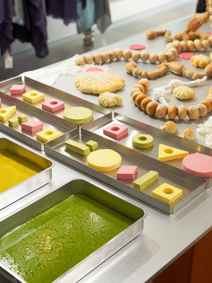 A creative display of flavored butters and bread for a bespoke catering event. The butters were colored and shaped to mimic the dyeing process of fabrics, showing our ability to create truly customized culinary experiences.