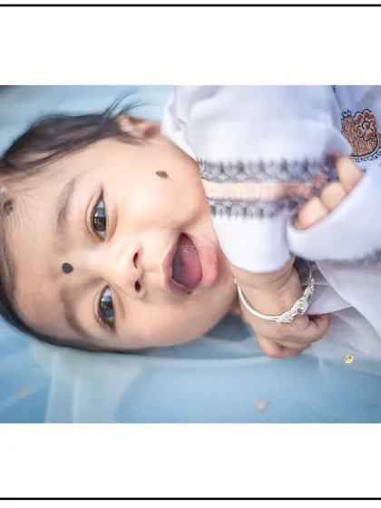 An adorable, expressive moment from a newborn photoshoot. Even when they are just a few days old, their little personalities start to shine through.