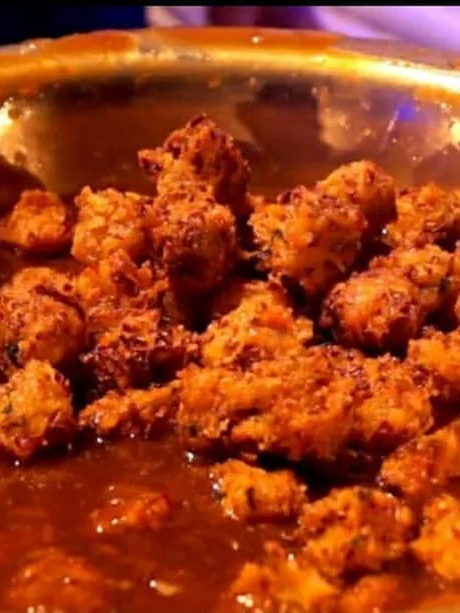 A close-up of our Gobi Manchurian, a popular dry starter. Crispy cauliflower florets are tossed in a tangy and spicy Manchurian sauce, making it a flavourful and addictive appetizer.