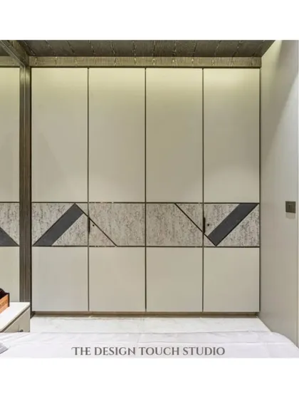 A close-up of the wardrobe, showing how the geometric pattern from the headboard is seamlessly integrated into the design. This demonstrates our attention to detail and our ability to create custom, unified spaces.