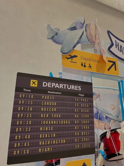 I love creating immersive details, like this custom 'Departures' board listing cities around the world, sparking the imagination for future adventures.