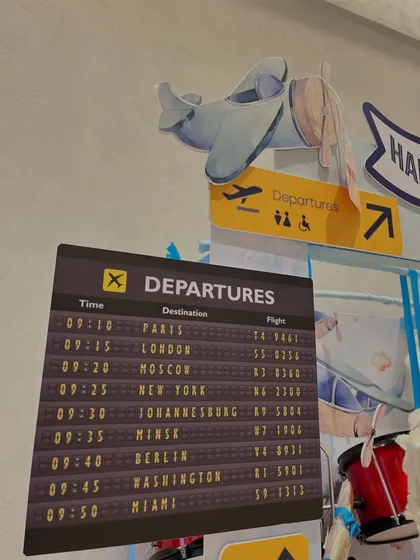 I love creating immersive details, like this custom 'Departures' board listing cities around the world, sparking the imagination for future adventures.