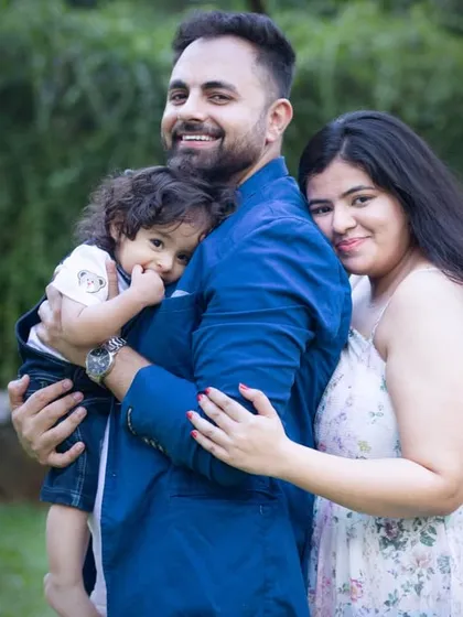 A quiet moment of togetherness for this family of three. This image shows the calm and loving side of their outdoor family photography session.