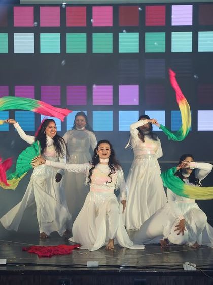 Graceful and elegant, our ladies' batch performs a semi-classical piece using colorful fabric props. Their synchronized movements create a beautiful visual spectacle.