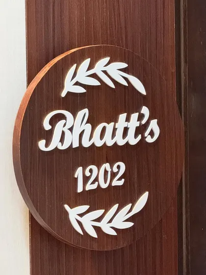 A custom wooden nameplate for the "Bhatt's" residence. Personal touches like these are part of my turnkey service, ensuring every detail of the entrance is considered.
