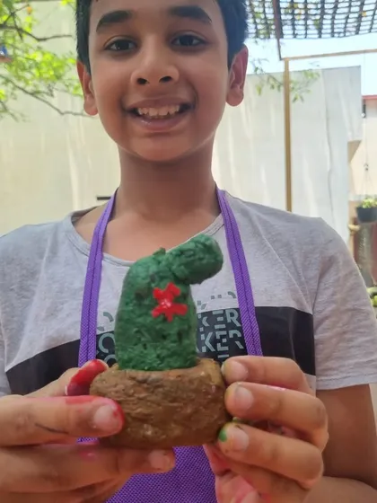 This young man created a fantastic paper mache cactus sculpture. Our camps include recycle projects that teach kids to create art from everyday materials.
