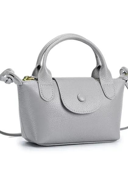 The Metro Mini bag in a sophisticated light grey. This neutral colour is a great alternative to black or white and pairs well with many outfits.