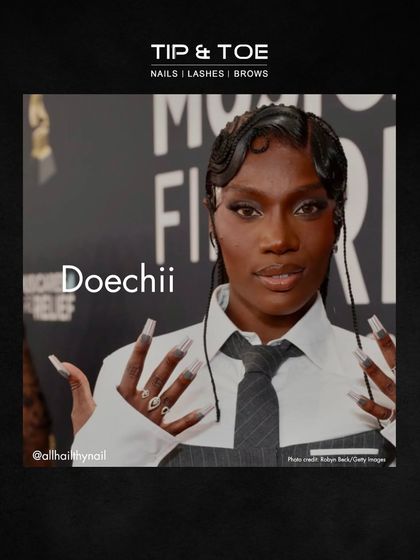 Doechii's graphic black and white nails at the Grammys are a masterclass in bold design. This look is for those who aren't afraid to stand out.