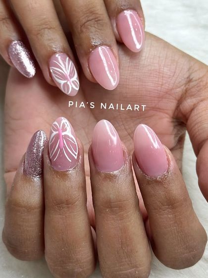 Our best-selling gel polish, shade N-38. It's the perfect nude pink, shown here with a delicate butterfly wing accent nail.