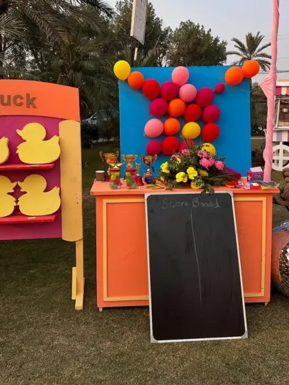 More fun carnival game rentals. This station includes a duck matching game and a balloon-popping board, with a scoreboard ready to track the winners and award prizes.