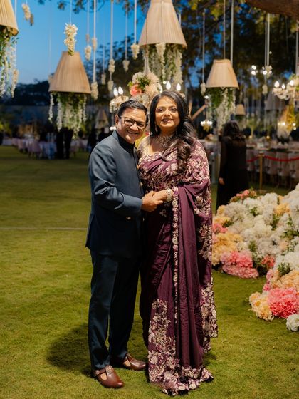 A beautiful family portrait from a pre-wedding reception. We styled the entire family, including this lovely couple, ensuring their outfits were elegant and perfect for an evening of celebration.