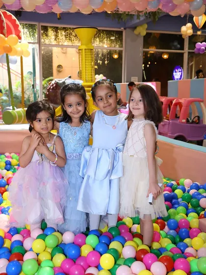 A group of friends enjoying the vibrant ball pit. It's a fantastic place for social play and making new buddies during a drop-in session.