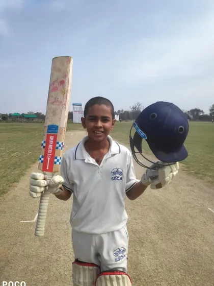 Chirag celebrating his century out on the pitch.