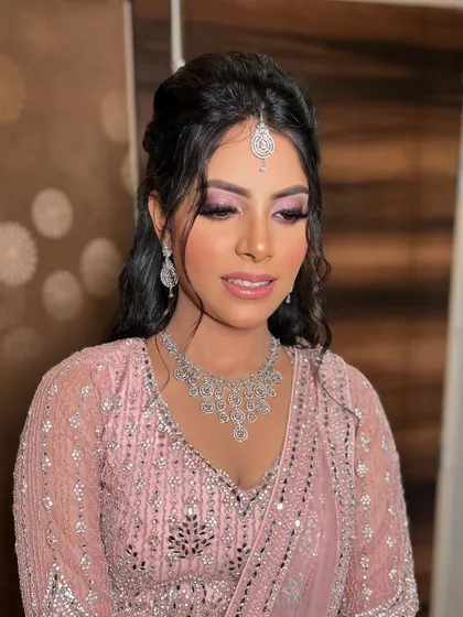 A close-up of Garima's beautiful makeup. The pink tones on her eyes and cheeks give her a fresh, romantic glow.