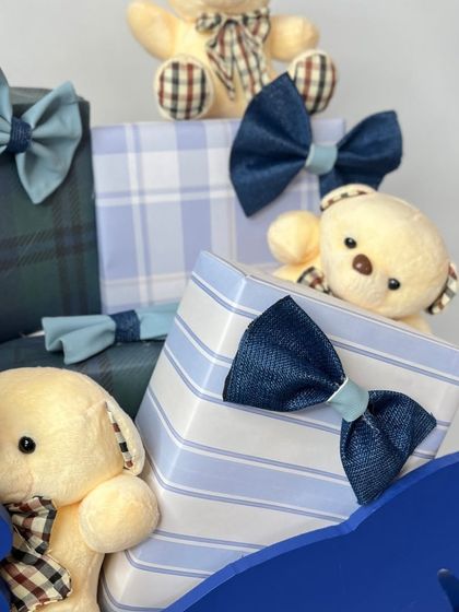 A shot showing the pile of beautifully wrapped gifts with teddy bears peeking out.