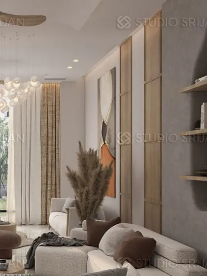 This living space combines a paneled wall with a large piece of abstract art and dried pampas grass, creating a look that is both modern and bohemian.