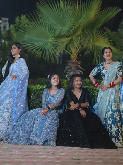 A group of friends dressed in a variety of my rental outfits, including lehengas and gowns in different styles and colors.